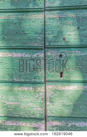 Detail of old wooden door of the typical house in Tucepi village, Croatia.