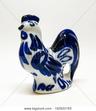 ceramic figurine rooster birds on an isolated white background