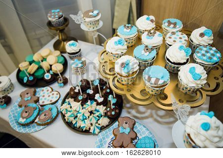 Delicious sweet buffet with cupcakes. Sweet holiday buffet with cupcakes and other desserts. Candy Bar.