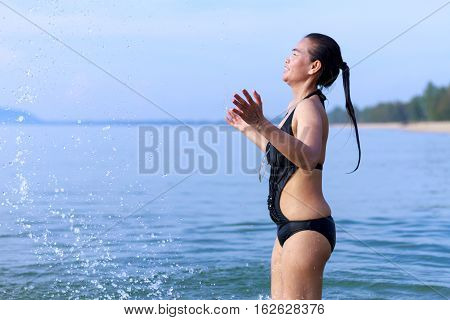 Lady enjoy play water relax in Ban Krut Beach at Prachuap Khirikhun Province Thailand