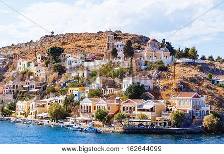 Greece. Dodecanesse. Island Symi Simi . Colorful houses on the rocks