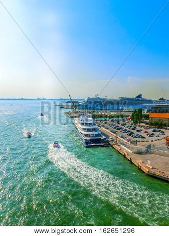 Venice, Italy - June 06, 2015: Cruise Ship Norwegian Jade by NCL docked at the port of Venice, Italy on a background of the roofs on June 06, 2015