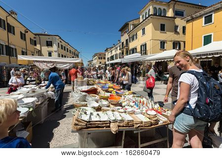 LAZISE ITALY - MAY 4 2016: The open air market in Lazise at Garda Lake. Italy