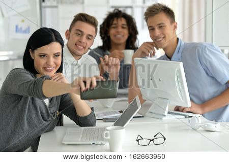 Young business people mking selfie in the office