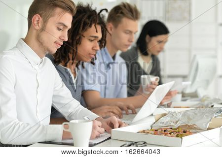 Portrait of young businesspeople working in ofiice