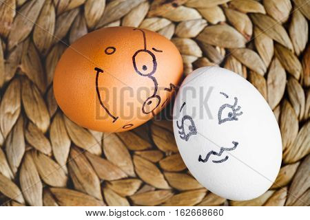 concept human relationships and emotions eggs flirtation on mat top view