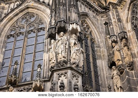 Stone figures from the facade of Aachen Cathedral, Germany