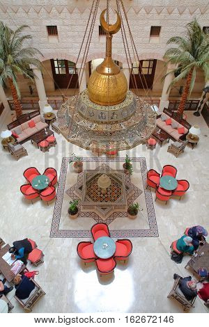 PETRA, JORDAN - MARCH 10, 2016: The magnificent courtyard atrium of the Movenpick Hotel located at the entrance of the site