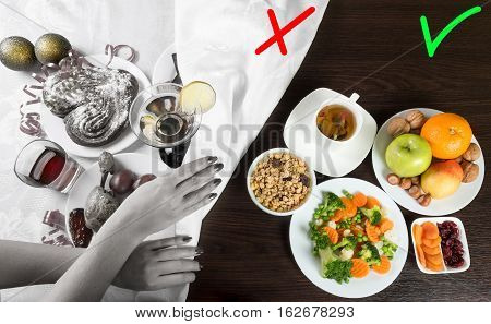 Table with healthy and unhealthy food and alcohol. Woman hands covering the part with harmful dishes and drinks with table cloth. Dieting after Christmas and New Year celebration.