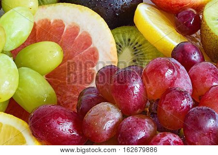 Fresh fruit slices. Juicy fruits. Various fruit close-up