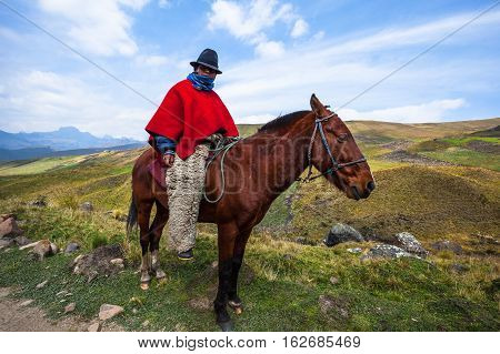 Ozogoche Ecuador December 19 2015: Unidentified Cowboys with red poncho and 
