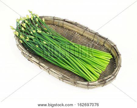 bunch of fresh chives on a wooden cutting board