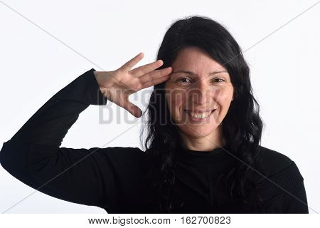 Woman making a military greet isolated on a white color
