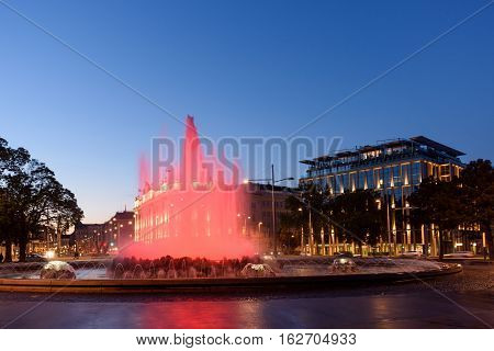 The heroes monument of the red army in schwarzenbergplatz at night with red light fountain in vienna, austria