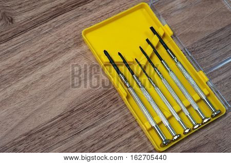 mini screwdriver set in a yellow box on the table