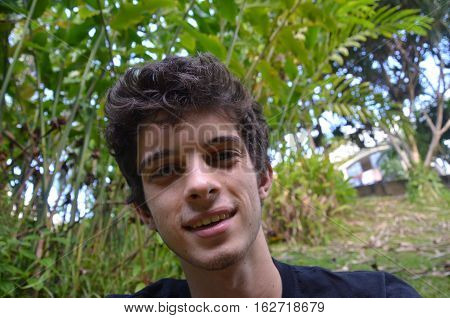 White Man on the Nature garden smiling