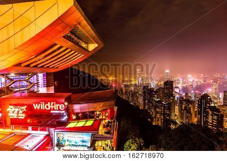Hong Kong, China - December 7, 2016: close up of Peak Tower and rooftop restaurant by night. The Sky Terrace 428, the viewing platform on top of the Peak Tower, is a icon building in Hong Kong.