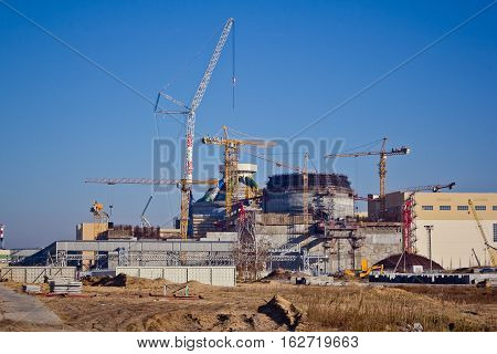 Construction site. Construction of a new nuclear power plant. Cranes are working at building