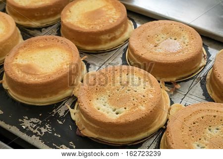 The group of Japanese red bean cake dessert on hole bean cake maker at food street market.