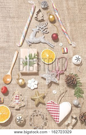 Christmas tree made by vintage items and Christmas ornaments - toned image