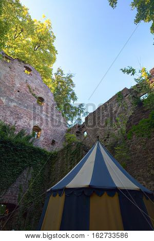 Ruined Part Of Castle Neuenbuerg In Germany With A Medieval Tent