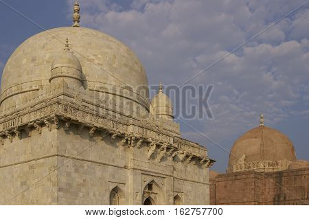 MANDU, MADHYA PRADESH, INDIA - NOVEMBER 19, 2008: Ancient islamic tomb of Hoshang Shah in the hilltop fortress of Mandu in Madya Pradesh, India. White marble building. 15th Century AD