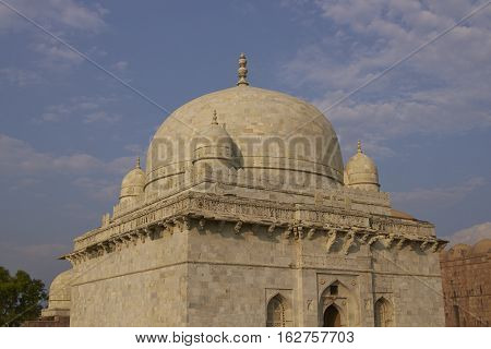 MANDU, MADHYA PRADESH, INDIA - NOVEMBER 19, 2008: Ancient islamic tomb of Hoshang Shah in the hilltop fortress of Mandu in Madya Pradesh, India. White marble building. 15th Century AD