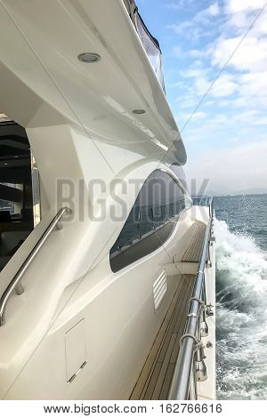 Side Wooden Hallway Of White Yacht And Blue Sky
