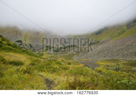 Beautiful Mountain Lake Surrounded By Impressive Mountains Of The Khamar-daban.