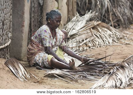 Illustrative image. Pondicherry Tamil Nadu India - July 03 2014. Poor woman worker in small village very hard work for little money roupies