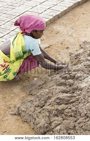 Illustrative image. Pondicherry Tamil Nadu India - July 03 2014. Poor woman worker in small village very hard work for little money roupies