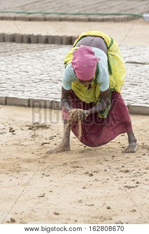 Illustrative image. Pondicherry Tamil Nadu India - July 03 2014. Poor woman worker in small village very hard work for little money roupies