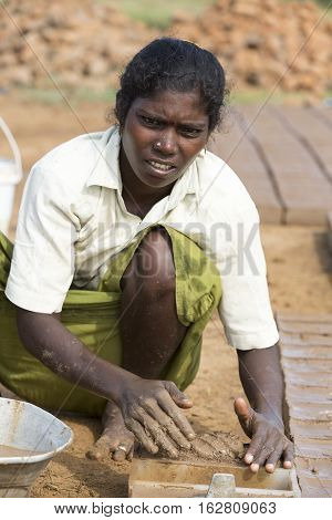 Illustrative image. Pondicherry Tamil Nadu India - July 03 2014. Poor woman worker in small village very hard work for little money roupies