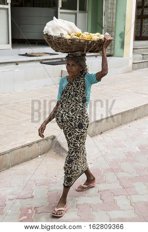 Illustrative image. Pondicherry Tamil Nadu India - July 03 2014. Poor woman worker in small village very hard work for little money roupies