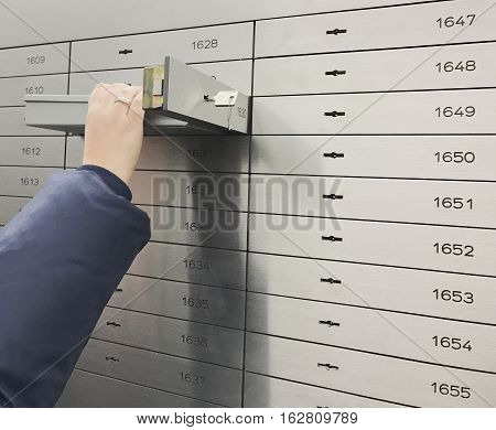 Safe deposit box open in a sure safe deposit cell