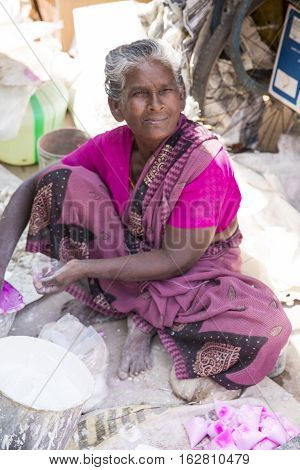 Illustrative image. Pondicherry Tamil Nadu India - July 03 2014. Poor woman worker in small village very hard work for little money roupies