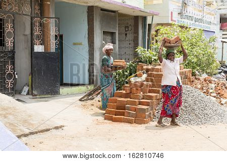 Illustrative image. Pondicherry Tamil Nadu India - July 03 2014. Poor woman worker in small village very hard work for little money roupies