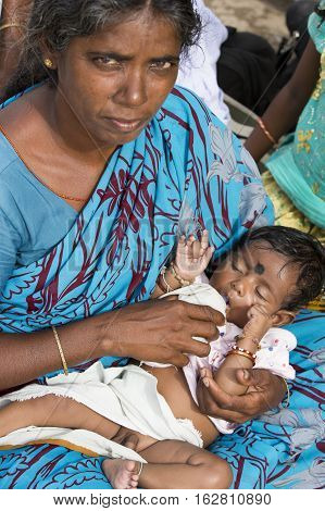 Illustrative image. Pondicherry Tamil Nadu India - July 03 2014. Poor woman worker in small village very hard work for little money roupies