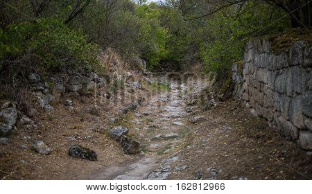 The road to Chufut-Kale - medieval cave town in Crimean Mountain. Bakhchisarai.