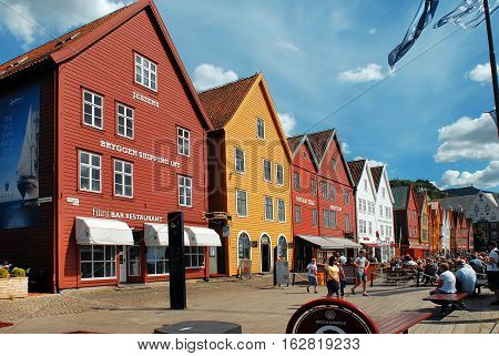 Bergen Norway - July 20 2014: Color buildings along the bay. Bergen is a row of old Hanseatic commercial buildings and a UNESCO World Heritage site.