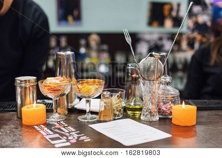 Set of bar accessories and ingredients for making a cocktails on counter