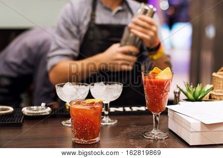 Barman show. Bartender is making cocktail at night club