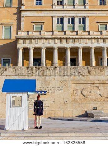 ATHENS, GREECE - DECEMBER 9: Evzone guard in front of the tomb of the Unknown soldier on December 9, 2016 in Athens. Their uniforms are based on traditional 19th century costume from southern Greece.