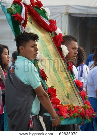 Mexico City Mexico - December 10 2016: Pilgrims celebrate the Festival of Our Lady of Guadalupe (Nuestra Senora de Guadalupe) with a mass ceremony in her honor in Basilica of Our Lady of Guadalupe