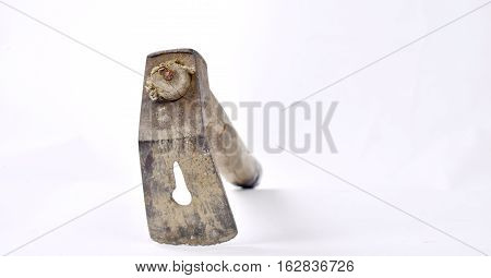 picture of an old dusty adz isolated on white