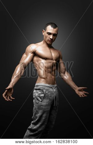 Strong Athletic Man Fitness Model Torso showing big muscles and exellent abs isolated with clipping path