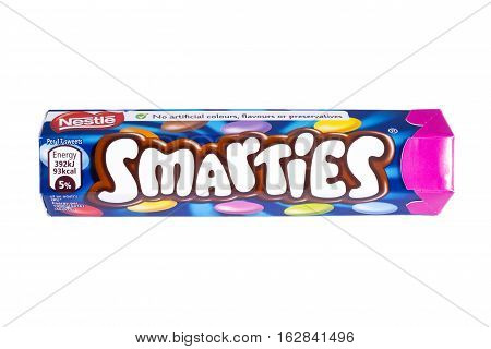 LONDON UK - OCTOBER 13TH 2016: An unopened Smarties chocolate sweets tube manufactured by Nestle pictured over a plain white background on 13th October 2016.