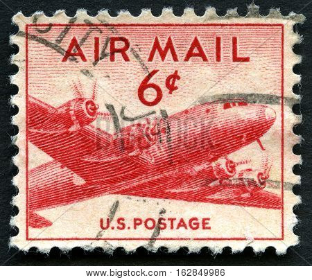 UNITED STATES OF AMERICA - CIRCA 1943: A used US Air Mail postage stamp depicting an illustration of a vintage transport plane circa 1943.