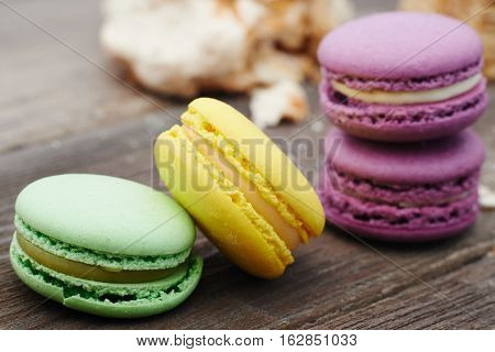 Set of sweets from cookies macaron on wooden table