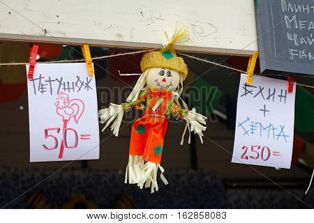 Moscow Russia - March 12 2016: Scarecrow and price tags (translated from the Russian 